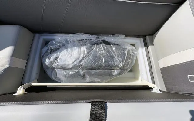 Slide: The Image of Storage compartment in 2025 Viaggio Lago X22U boat with packaged item inside. - 19