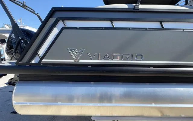Slide: The Image of 2025 Viaggio Lago X22U boat, sleek design, close-up view of branding. - 2