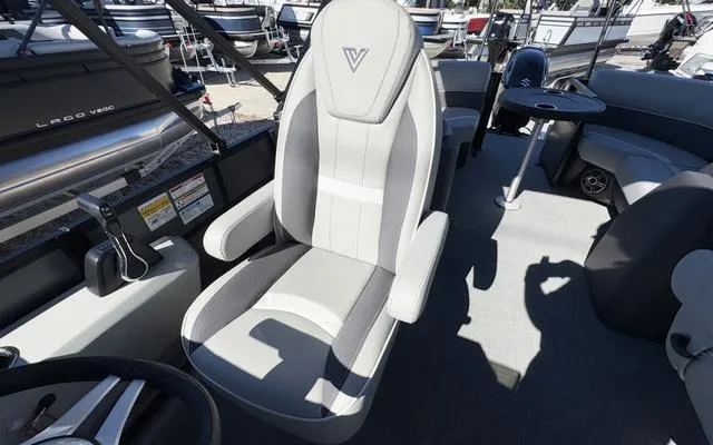 Slide: The Image of Captain's chair on 2025 Viaggio Lago X22U pontoon boat, featuring sleek design and modern controls. - 22