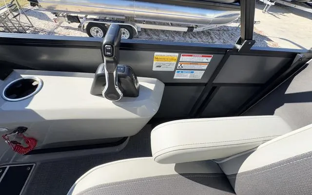 Slide: The Image of Interior view of 2025 Viaggio Lago X22U boat with control panel and seating. - 24