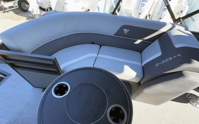 Slide: The Image of 2025 Viaggio Lago X22U boat interior with curved seating and round table. - 34
