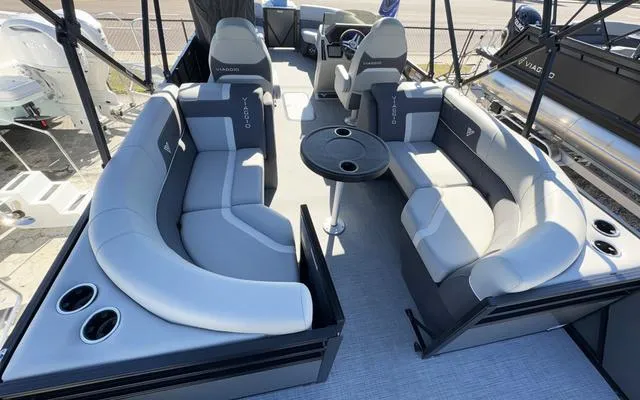 Slide: The Image of Luxurious 2025 Viaggio Lago X22U pontoon boat interior with plush seating and cup holders. - 40