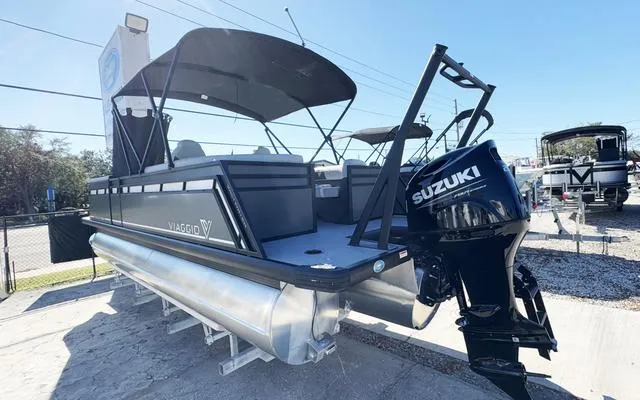 Slide: The Image of 2025 Viaggio Lago X22U pontoon boat with Suzuki outboard motor, displayed outdoors. - 8