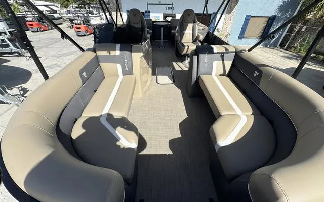 Slide: The Image of 2025 Viaggio Lago X 22 U pontoon boat interior with beige seating and modern design. - 12