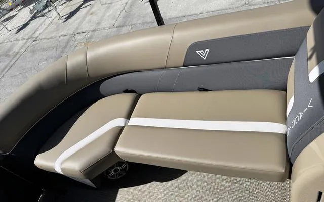 Slide: The Image of 2025 Viaggio Lago X 22 U boat interior with beige and gray seating. - 13