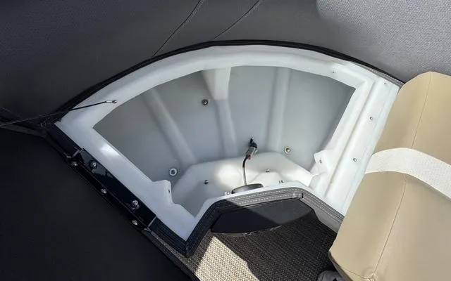 Slide: The Image of Viaggio Lago X 22 U 2025 boat storage compartment with beige seating and carpeted flooring. - 15
