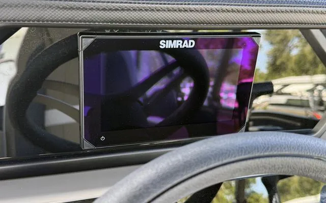 Slide: The Image of Simrad display on 2025 Viaggio Lago X 22 U dashboard, reflecting steering wheel. - 22