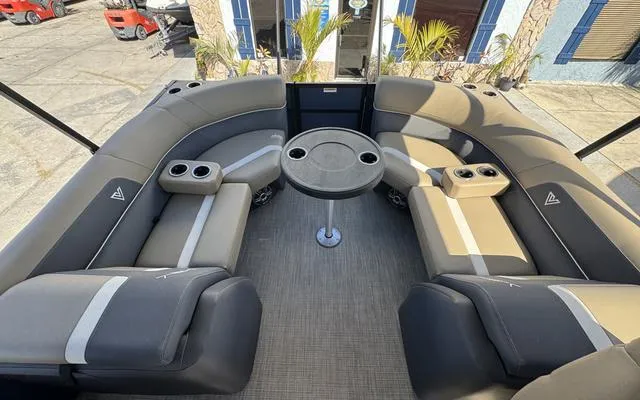 Slide: The Image of 2025 Viaggio Lago X 22 U boat interior with plush seating and central table. - 27