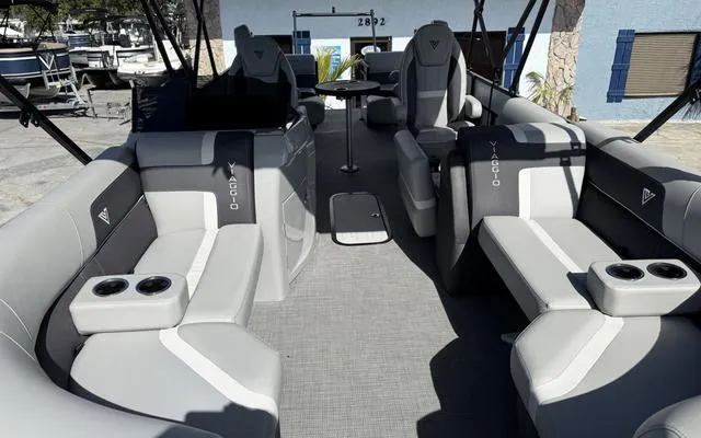 Slide: The Image of 2025 Viaggio LAgo X 22 Q pontoon boat interior with modern seating and cup holders. - 14