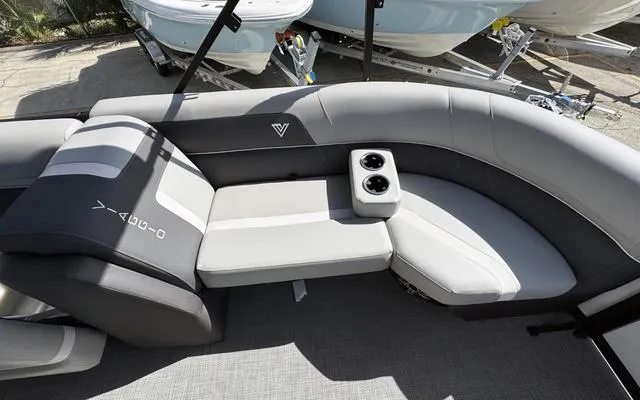 Slide: The Image of 2025 Viaggio LAgo X 22 Q boat interior with gray seating and cup holders. - 18