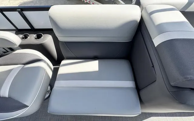 Slide: The Image of 2025 Viaggio LAgo X 22 Q boat interior with gray seating and cup holders. - 21