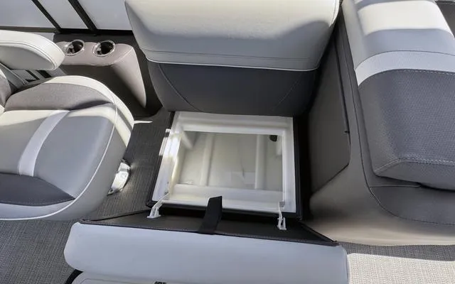 Slide: The Image of Interior of 2025 Viaggio LAgo X 22 Q boat with open storage compartment. - 22