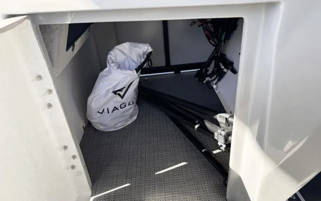 Slide: The Image of Storage compartment of 2025 Viaggio LAgo X 22 Q boat with equipment bag. - 29