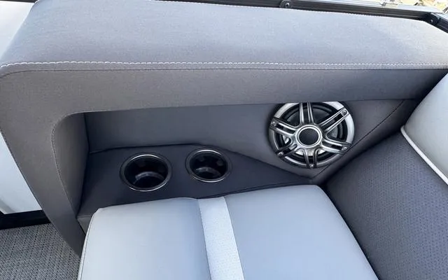 Slide: The Image of Viaggio LAgo X 22 Q 2025 boat interior with speaker and cup holders. - 32