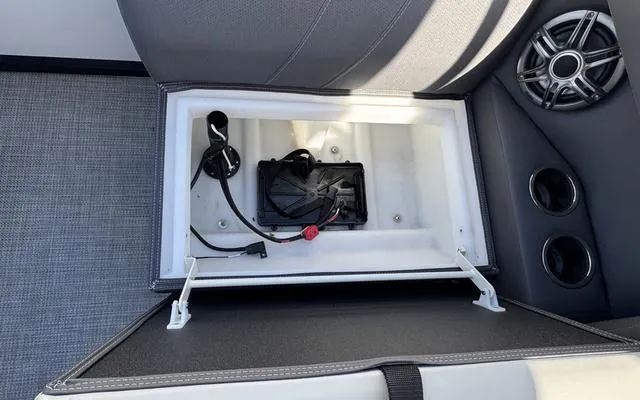Slide: The Image of Open storage compartment in 2025 Viaggio LAgo X 22 Q boat with wiring and speakers. - 34