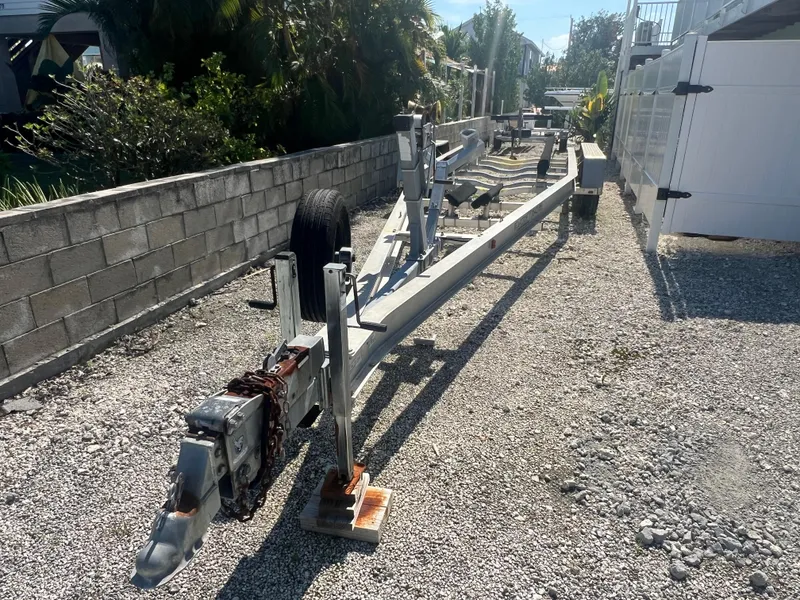 Slide: The Image of Trailer for 2004 Century 2900 Center Console on gravel driveway. - 16