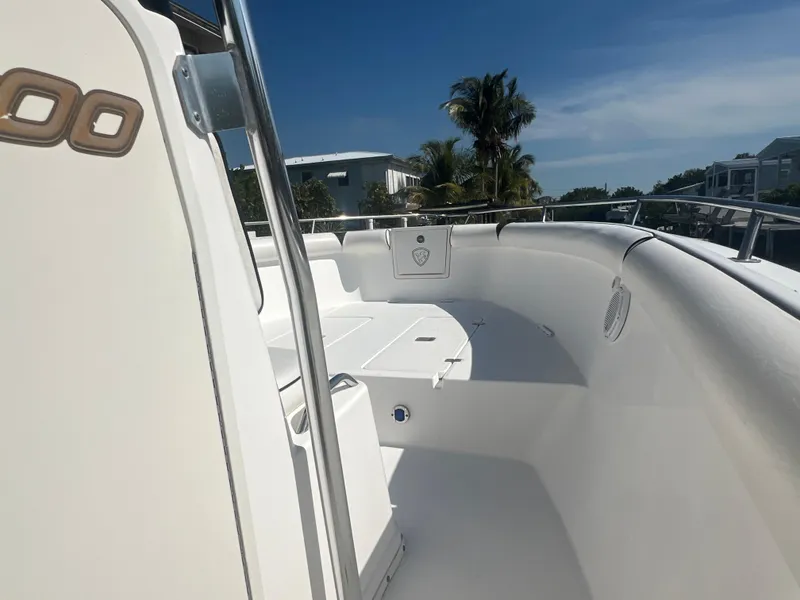 Slide: The Image of 2004 Century 2900 Center Console boat deck with clear sky and palm trees. - 9