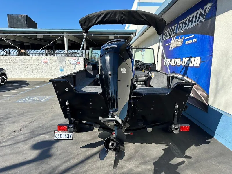 Slide: The Image of 2019 Lowe FM 165 Pro WT boat, rear view, parked outdoors. - 10