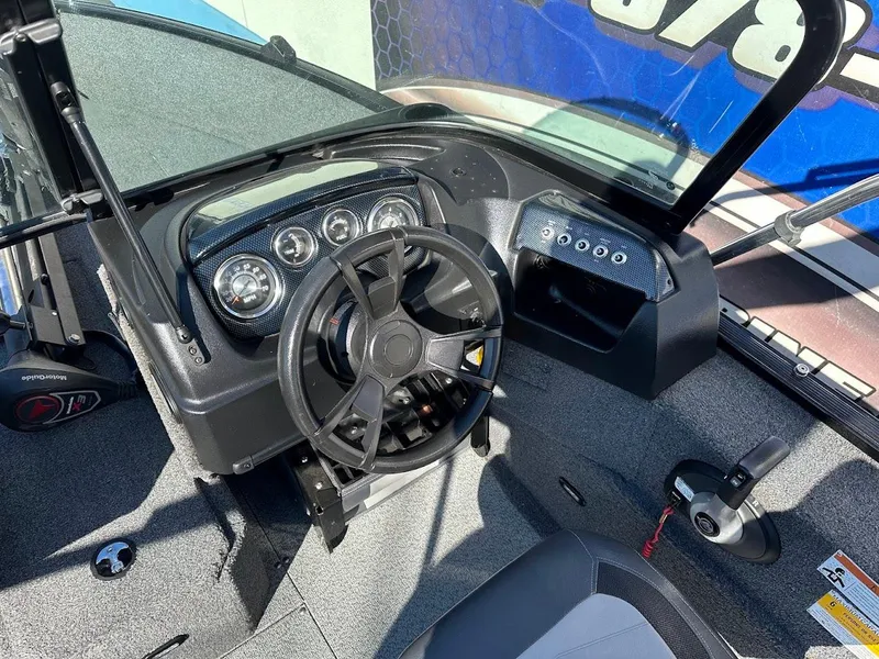 Slide: The Image of 2019 Lowe FM 165 Pro WT boat dashboard with steering wheel and instrument panel. - 18