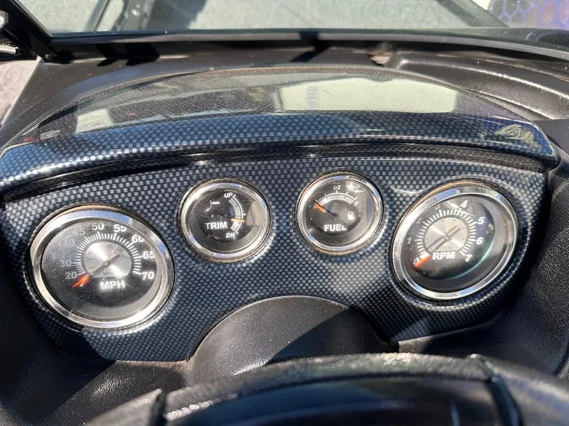 Slide: The Image of Dashboard of 2019 Lowe FM 165 Pro WT boat with speedometer, trim, fuel, and RPM gauges. - 19