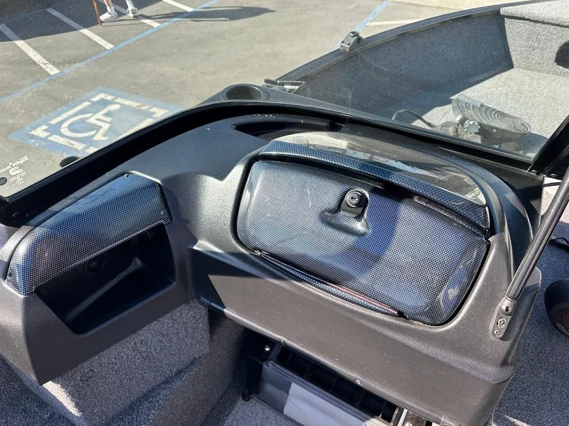 Slide: The Image of 2019 Lowe FM 165 Pro WT boat dashboard with storage compartments. - 20