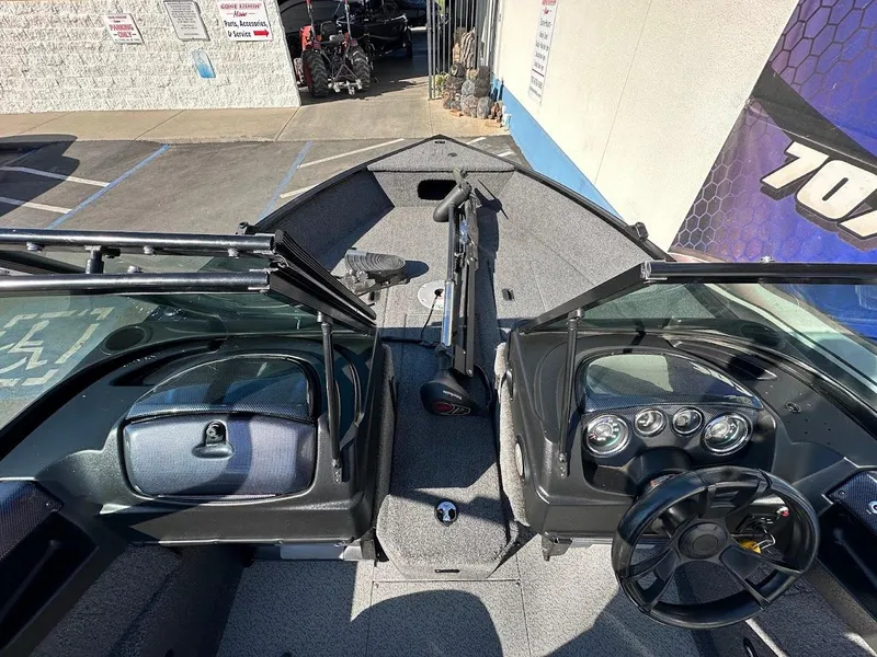 Slide: The Image of 2019 Lowe FM 165 Pro WT boat interior with steering wheel and dashboard. - 23