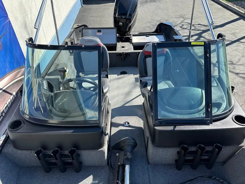 Slide: The Image of 2019 Lowe FM 165 Pro WT boat interior with dual windshields and seating. - 25