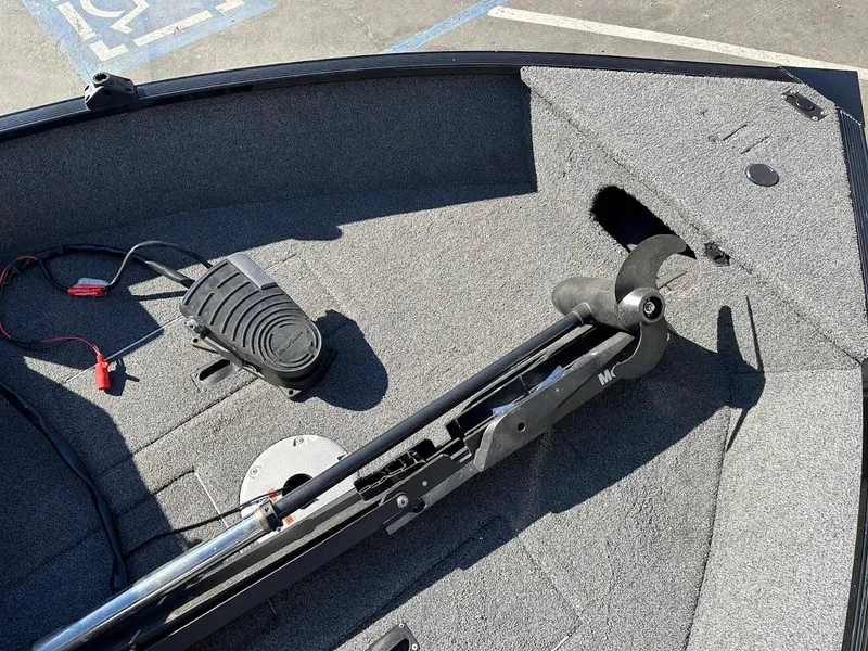 Slide: The Image of 2019 Lowe FM 165 Pro WT boat interior with trolling motor and pedal. - 27