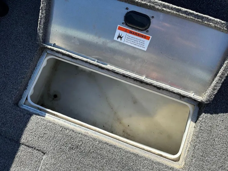 Slide: The Image of Open storage compartment in 2019 Lowe FM 165 Pro WT boat. - 29