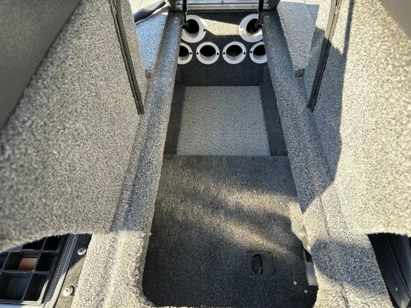 Slide: The Image of 2019 Lowe FM 165 Pro WT boat interior with rod storage compartments. - 31