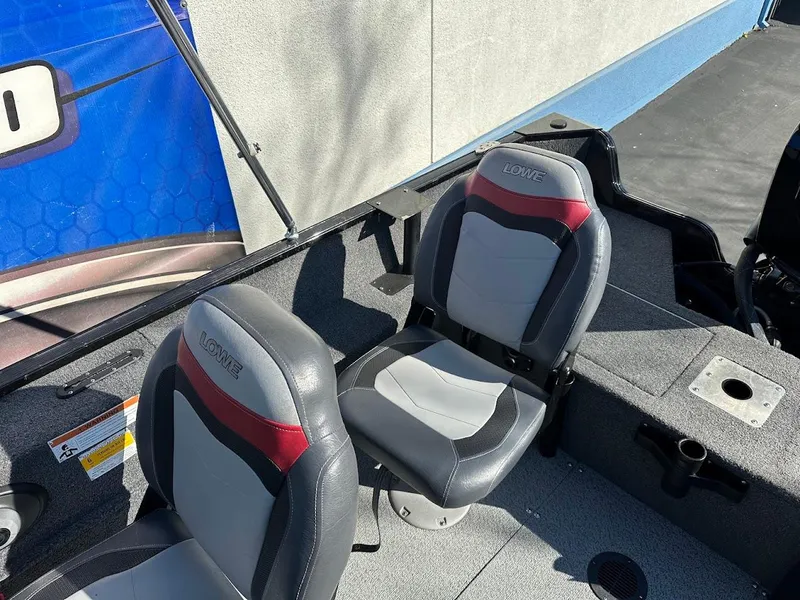 Slide: The Image of 2019 Lowe FM 165 Pro WT boat interior with two cushioned seats. - 33