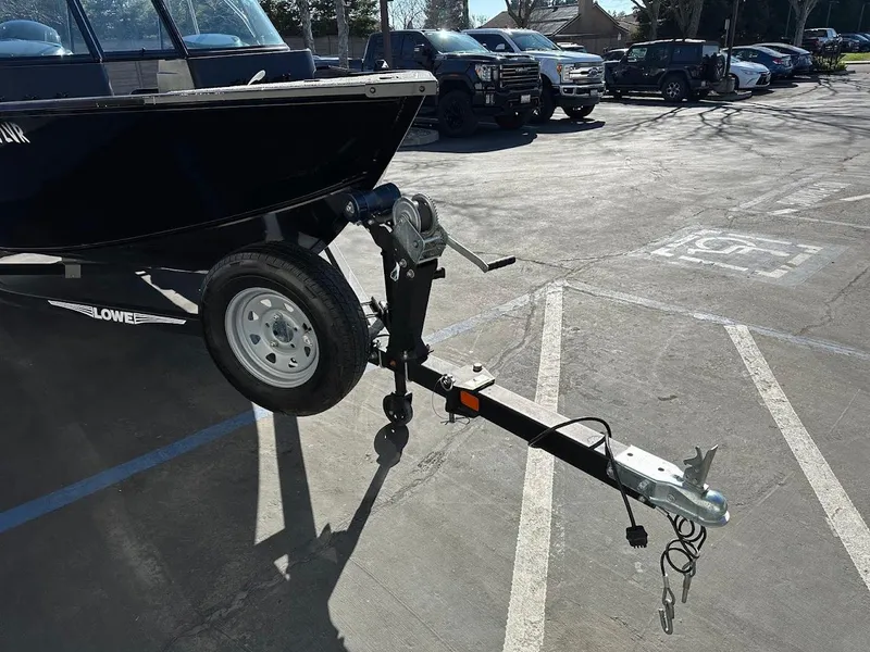 Slide: The Image of 2019 Lowe FM 165 Pro WT boat trailer in parking lot. - 4