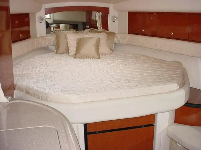 Slide: The Image of Interior of 2003 Sea Ray 340 Sundancer with cozy bed and elegant cushions. - 14