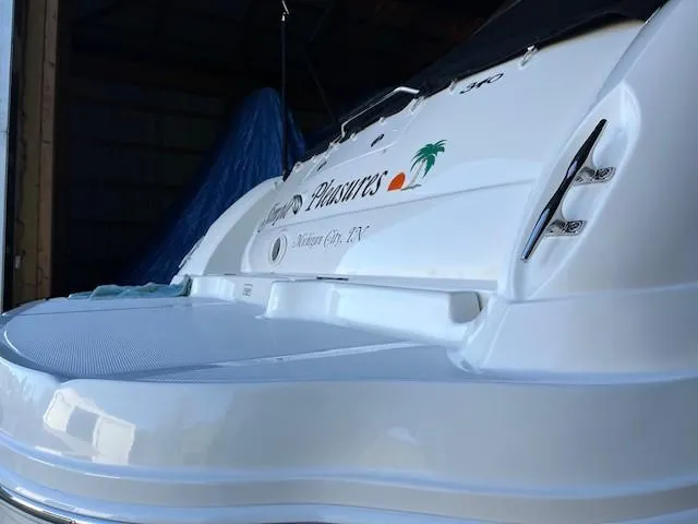 Slide: The Image of 2003 Sea Ray 340 Sundancer boat stern view in storage. - 5