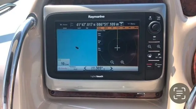 Slide: The Image of Raymarine navigation system on 2003 Sea Ray 340 Sundancer boat dashboard. - 7