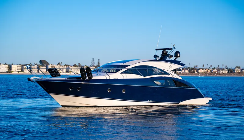 Slide: The Image of 2009 Marquis 420 Sport Coupe yacht cruising on calm blue waters. - 0