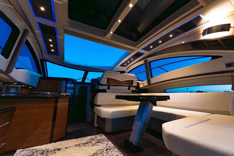 Slide: The Image of Luxurious interior of 2009 Marquis 420 Sport Coupe yacht with modern lighting and seating. - 12