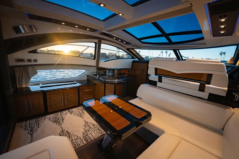 Slide: The Image of Luxurious interior of a 2009 Marquis 420 Sport Coupe yacht with modern furnishings. - 13