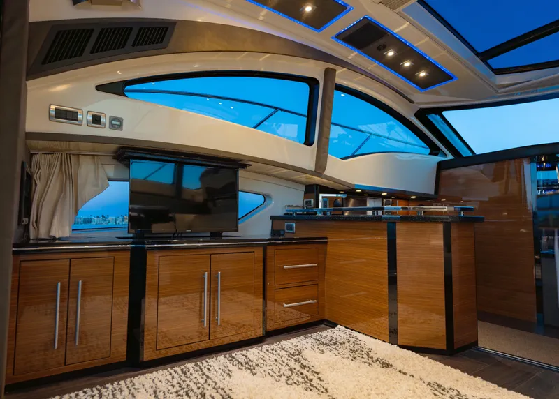 Slide: The Image of Luxurious interior of 2009 Marquis 420 Sport Coupe yacht with modern wood cabinetry. - 14