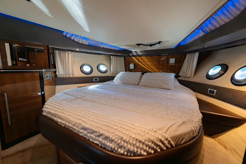 Slide: The Image of Luxurious interior of 2009 Marquis 420 Sport Coupe yacht with elegant bedding and ambient lighting. - 20