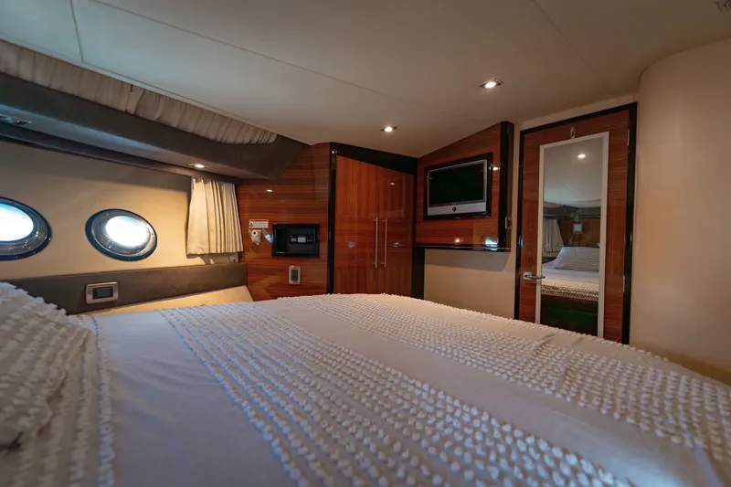 Slide: The Image of Luxurious interior of 2009 Marquis 420 Sport Coupe yacht bedroom. - 21