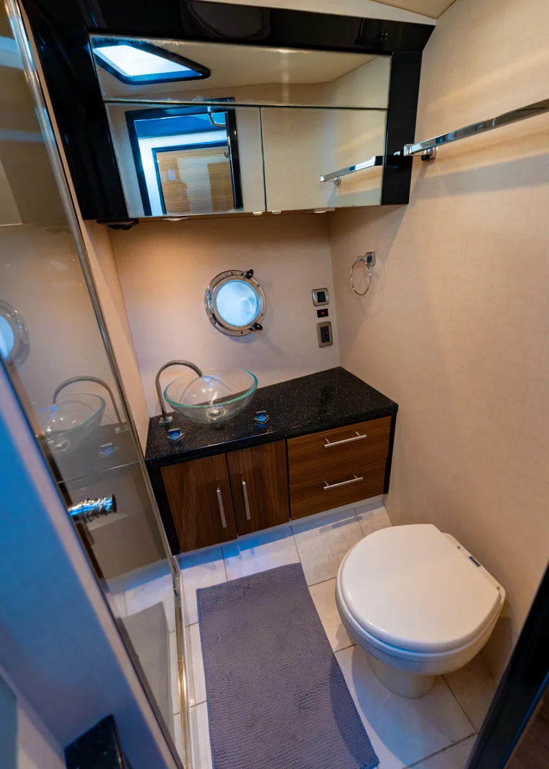 Slide: The Image of 2009 Marquis 420 Sport Coupe bathroom with modern fixtures and porthole window. - 23