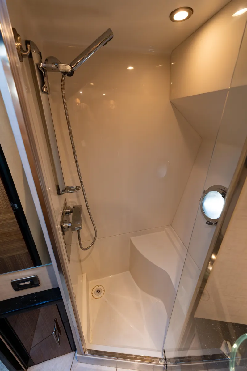 Slide: The Image of Shower area in 2009 Marquis 420 Sport Coupe yacht, featuring modern fixtures and lighting. - 24