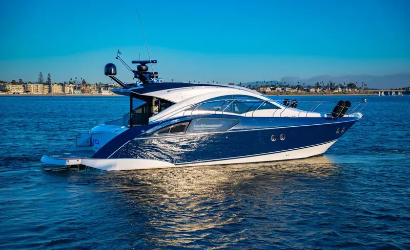 Slide: The Image of 2009 Marquis 420 Sport Coupe yacht cruising on a sunny day. - 4
