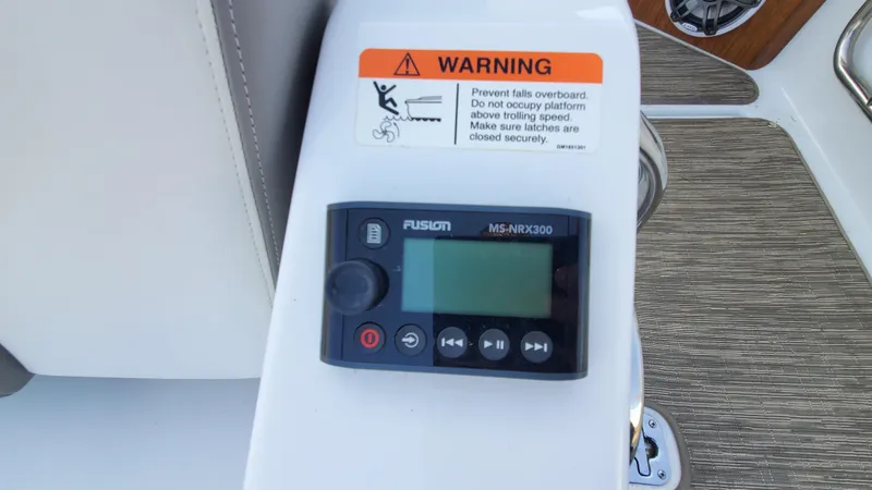 Slide: The Image of Fusion MS-NRX300 marine stereo on 2021 Four Winns H350 boat with safety warning label. - 24