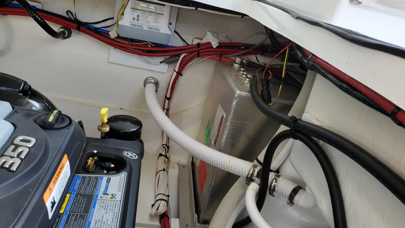 Slide: The Image of Engine compartment of 2021 Four Winns H350 boat, showing wiring and components. - 38