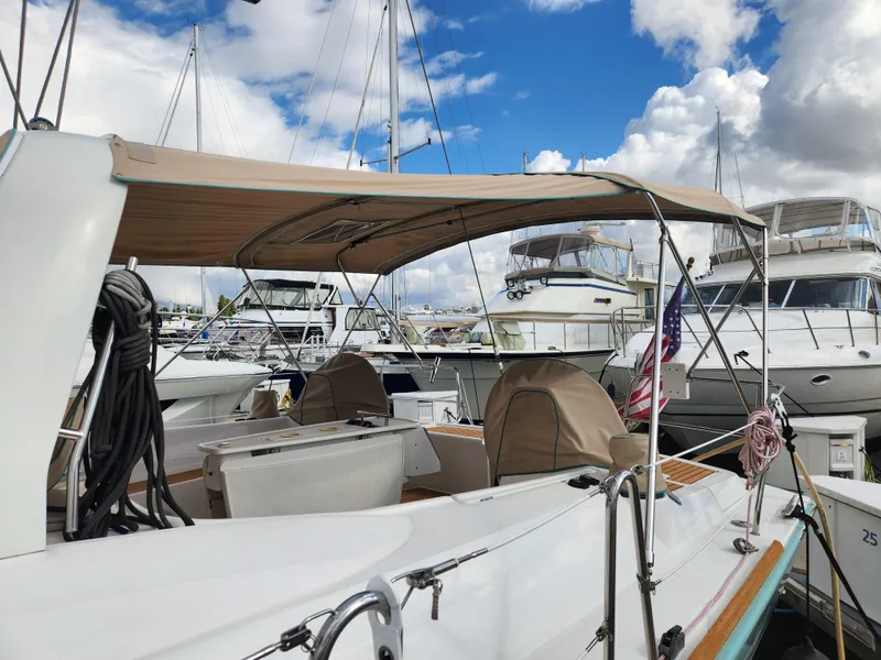 Slide: The Image of Beneteau Oceanis 50 sailboat, 2012 model, docked at marina under cloudy sky. - 11