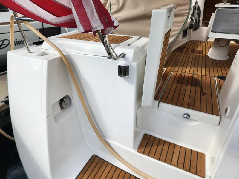 Slide: The Image of Beneteau Oceanis 50 yacht deck, teak flooring, American flag, 2012 model. - 14