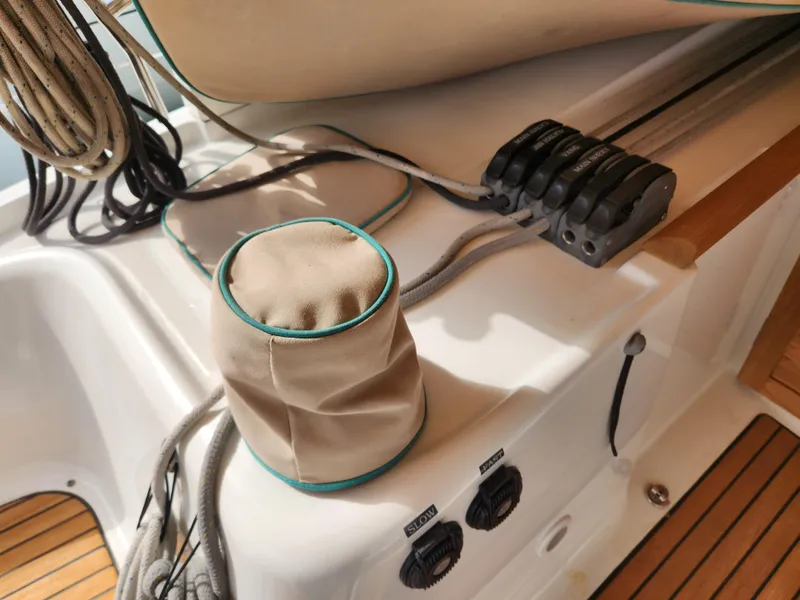 Slide: The Image of Deck of 2012 Beneteau Oceanis 50 sailboat with ropes and winch cover. - 17