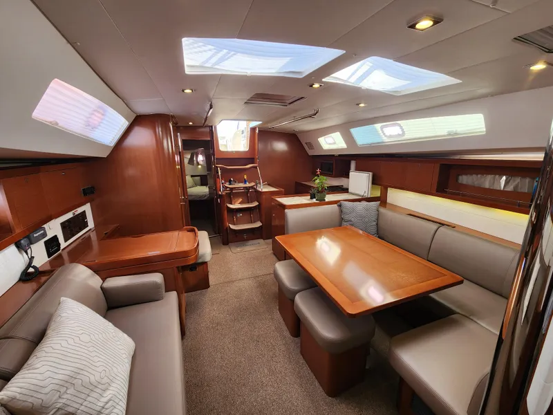 Slide: The Image of Luxurious interior of 2012 Beneteau Oceanis 50 yacht with elegant seating and dining area. - 26